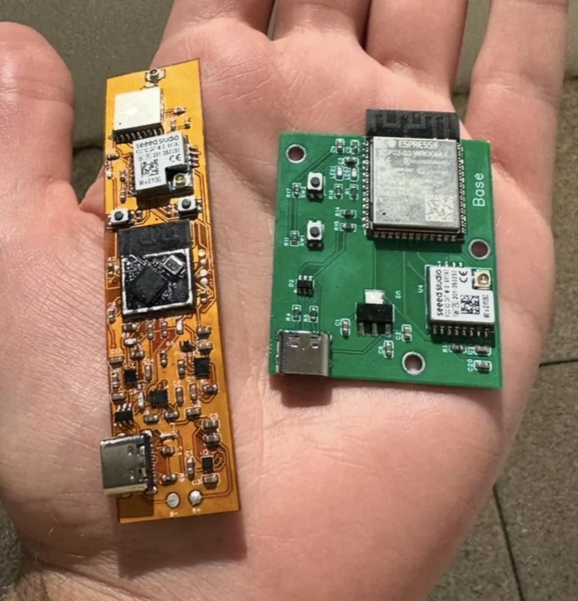 Flexible pet-tracker PCB beside its receiver base prototype